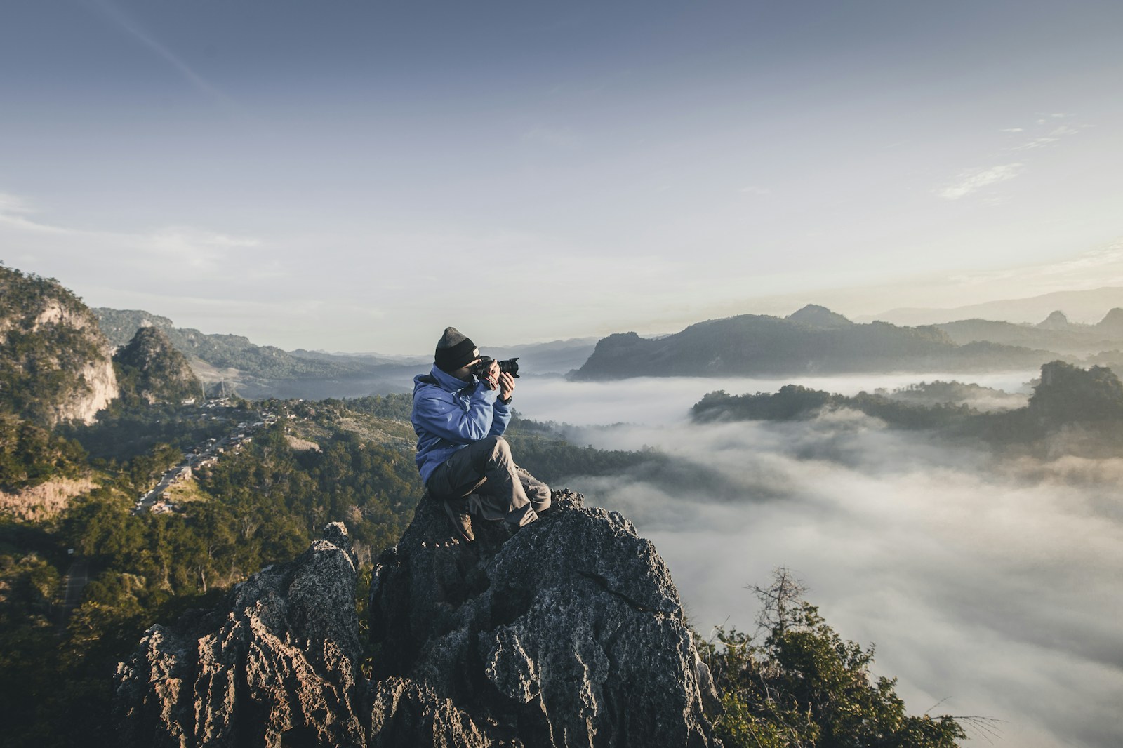 Photographer working on location in a mountain landscape