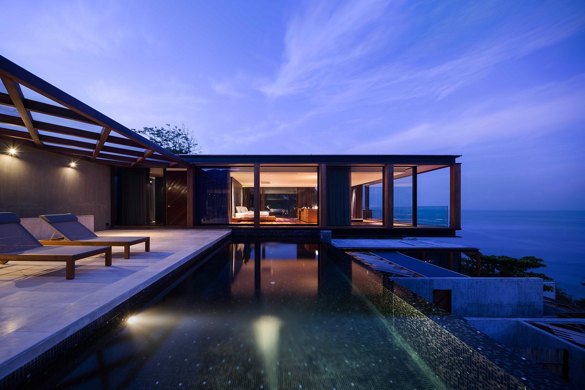 Oceanfront villa and pool at dusk